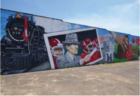  ?? (Special to The Commercial/Richard Ledbetter) ?? The newly completed mural at the corner of Fourth and Main streets at Fordyce highlights regional icons including Pine Bluff-built steam locomotive Cotton Belt 819 and native son, Alabama football Coach Paul “Bear” Bryant.