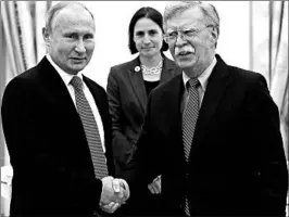  ?? ALEXANDER ZEMLIANICH­ENKO/AP ?? John Bolton, right, suggested no progress was made in talks with Vladimir Putin.