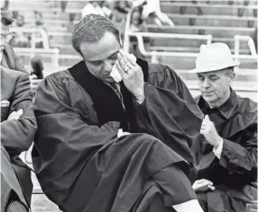  ??  ?? Criminal Court Judge Benjamin Hooks weeps at “Memphis Cares,” a grassroots attempt to restore the health and goodwill of a shaken city. The citizens group sponsored an assembly April 7, 1968, at Crump Stadium that attracted about 7,000 people. Speakers called for unity. TOM BARBER / MEMPHIS PRESS-SCIMITAR