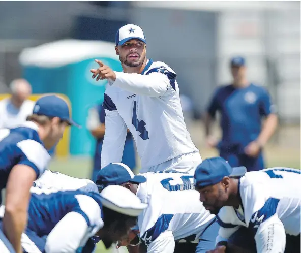  ?? — THE ASSOCIATED PRESS FILES ?? Cowboys QB Dak Prescott gestures during a drill at NFL football training camp in Oxnard, Calif. on Tuesday.