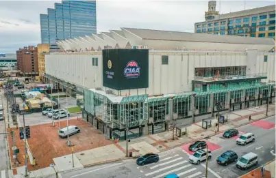  ?? JERRY JACKSON/BALTIMORE SUN ?? Workers prepare CFG Arena Friday for next week’s 2023 CIAA men’s and women’s basketball tournament­s.