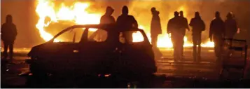  ??  ?? A history of violence: Youths set cars ablaze as they battled police in Paris in 2005