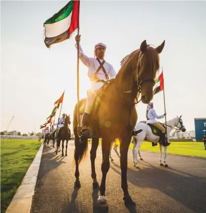  ?? Photos by Neeraj Murali ?? The 116 Dubai Police horses parade around Meydan during the Guinness World Record feat on Sunday. —