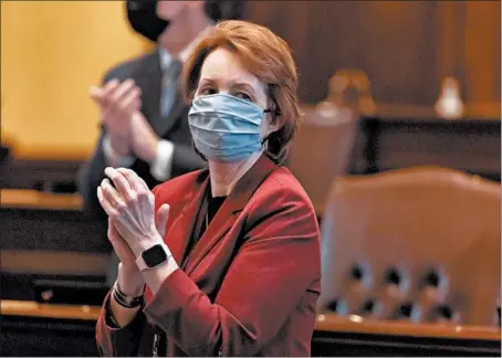  ?? BRIAN CASSELLA/CHICAGO TRIBUNE ?? Bill sponsor state Sen. Ann Gillespie applauds during a session Wednesday at the Illinois Capitol in Springfiel­d.