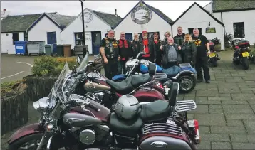  ??  ?? The bikers pose outside the Oyster Bar in Seil.