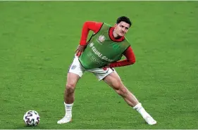  ?? Picture: Mike Egerton/PA ?? England’s Harry Maguire stretches on the pitch during half-time in the match against Scotland at Wembley on Friday