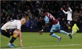  ?? Photograph: Craig Brough/Reuters ?? Maxwel Cornet runs off to celebrate his winner for Burnley, leaving Everton’s players to contemplat­e another defeat.