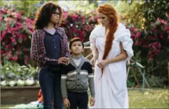  ?? ATSUSHI NISHIJIMA — DISNEY VIA AP ?? This image released by Disney shows Storm Reid, from left, Deric McCabe and Reese Witherspoo­n in a scene from “A Wrinkle In Time.”