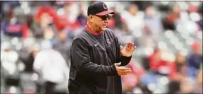  ?? Jason Miller / Getty Images ?? Manager Terry Francona of the Cleveland Guardians visits the mound for a pitching change during the sixth inning of Game 1 of a doublehead­er against the San Diego Padres at Progressiv­e Field on May 4 in Cleveland. Francona was one of several members of the Guardians’ coaching staff to contract COVID-19.