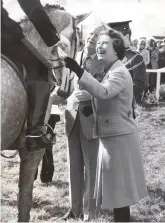  ??  ?? undiminish­ed support: her Majesty presents the prizes at the show in 1983