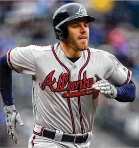  ?? MATTHEW STOCKMAN / GETTY IMAGES ?? First baseman Freddie Freeman is an MVP candidate. He’s tied for the most walks, is hitting .325 and his eight extra-base hits are one off the NL lead.