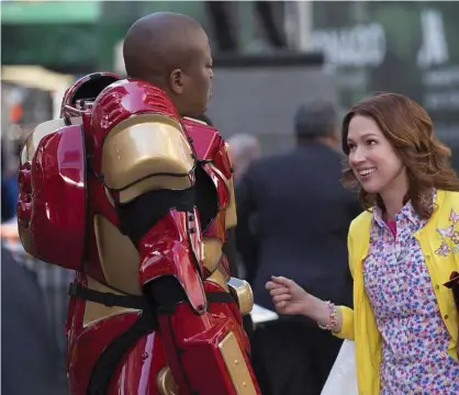  ??  ?? Tituss Burgess, left, and Ellie Kemper appear in a scene from the comedy “Unbreakabl­e Kimmy Schmidt Eric Leibowitz / Netflix via Associated Press