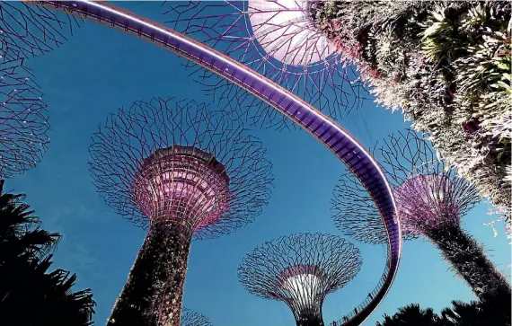  ?? PHOTO BY KARL WIXON ?? A visit to Gardens by the Bay light and sound show is a must for any trip to Singapore. Our family was so impressed with it that we went to it three nights out of our eight-night stay in Singapore – and it’s free. Marina Bay Sands and Gardens by the...