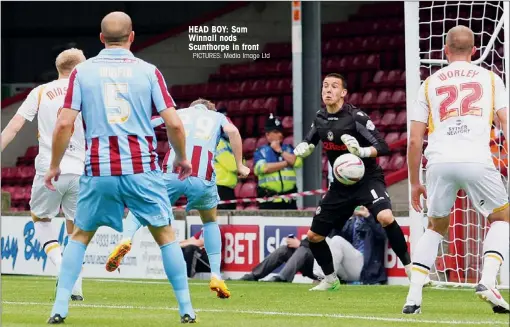  ?? PICTURES: Media Image Ltd ?? HEAD BOY: Sam Winnall nods Scunthorpe in front