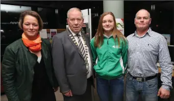  ??  ?? Mona with her parents Viola and Aidan McSharry with Cathaoirle­ach Cllr Seamus Kilgannon.