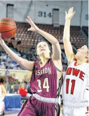  ?? [PHOTO BY BRYAN TERRY, THE OKLAHOMAN] ?? Cashion’s Sydney Manning goes to the basket beside Howe’s Jalei Oglesby during Friday’s Class 2A girls state basketball game.