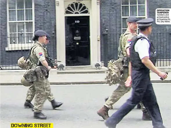  ??  ?? OPERATION TEMPERER Soldiers and armed police at Downing St. Pic: Sky News