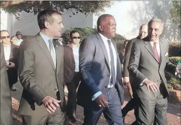  ?? Jenny Jarvie For The Times ?? LOS ANGELES MAYOR Eric Garcetti visits the University of South Carolina on Wednesday with Columbia, S.C., Mayor Steve Benjamin, center, and University of South Carolina President Harris Pastides.