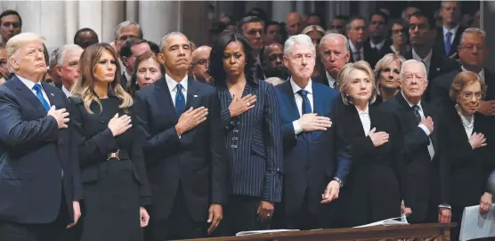  ?? MOURNING: President Donald Trump ( from left), Melania Trump, Barack Obama, Michelle Obama, Bill Clinton, Hillary Clinton, Jimmy Carter and Rosalynn Carter at the State Funeral for former US President George H. W. Bush, at the National Cathedral in Washin ??