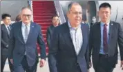 ?? AP ?? Russian foreign minister Sergey Lavrov (centre) walks from the plane upon his arrival in Beijing, China, on Monday.