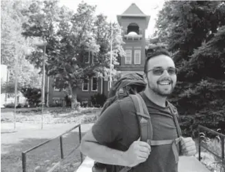  ?? Photos by Helen H. Richardson, The Denver Post ?? Nigel Knutzen poses for a portrait on the Naropa University campus last week in Boulder. Knutzen walked 925 miles in 13 days to get there.