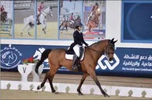  ??  ?? Maryam Ahmad Al Boinin astride Silvan in the Level 1 dressage event of Longines Hathab Round 4 at Qatar Equestrian Federation’s indoor arena on Saturday.
