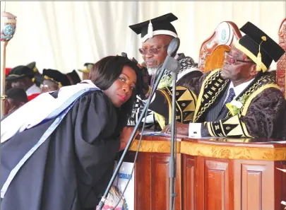  ?? Picture by John Manzongo ?? President Mugabe caps The Sunday Mail Assistant Editor Wendy Nyakurerwa who graduated with a first class Masters Degree in Strategic Management at Chinhoyi University of Technology yesterday.