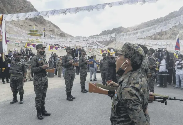 ??  ?? 0 Indian soldiers at the funeral of Tibetan-origin Indian special forces soldier Nyima Tenzin – India claims he was killed in the latest border showdown with Chinese troops
