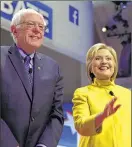  ?? / RWOOD@JOURNALSEN­TINEL.COM ?? Bernie Sanders and Hillary Clinton pose for pictures during their debate Thursday.