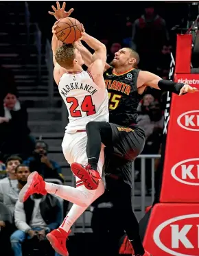  ?? AP ?? Chicago Bulls forward Lauri Markkanen goes up to shoot despite the efforts of Atlanta Hawks centre Alex Len in their NBA clash yesterday.
