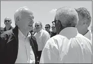  ?? Arkansas Democrat-Gazette/DALE ELLIS ?? Gov. Asa Hutchinson talks with residents before a May 30 news conference on flooding in Fort Smith. Hutchinson said he met with many Arkansans as he viewed the flood damage and that he found their spirit of determinat­ion and helpfulnes­s inspiring.