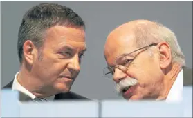  ?? Picture: REUTERS ?? TARGETS: Daimler CEO Dieter Zetsche, right, talks to chief financial officer Bodo Uebber during Daimler’s annual general meeting in Berlin yesterday.