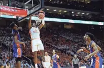  ?? / The Daily Times-Joy Kimbrough via AP ?? Tennessee guard Admiral Schofield dunks during the game against Florida in Knoxville, Tenn. Tennessee was ranked No. 1 on the AP Top 25 poll.