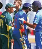  ??  ?? Red mist: David Warner was fined for this spat with India’s Rohit Sharma