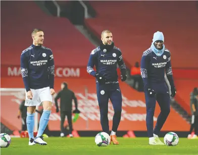 ?? SHAUN BOTTERILL / POOL / AFP VIA GETTY IMAGES ?? Manchester City manager Pep Guardiola said defender Benjamin Mendy, far right, shouldn't have had some friends to his house on New Year's Eve, but he said that many other people in England probably broke lockdown rules, too.