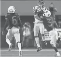  ?? JENNIFER STEWART/GETTY IMAGES ?? Arizona’s Tristan Cooper breaks up a pass intended for USC’s Michael Pittman Jr.