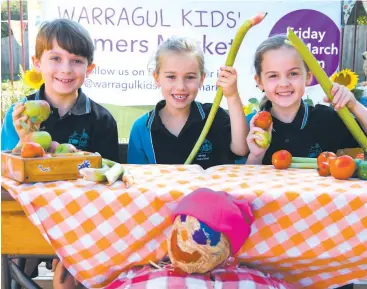  ??  ?? Getting their fresh produce ready for Australia’s first ever Kids Farmers’ Market on Friday are Warragul Primary School students (from left) Jack Marsden, Amalie Marriott and Ivy Ward.