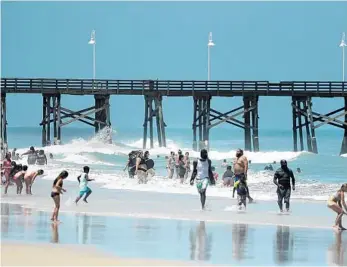  ?? STEPHEN M. DOWELL/ORLANDO SENTINEL ?? Daytona Beach is crowded with beachgoers Aug. 1. A certain level of caution and respect is necessary when venturing out to Florida beaches during the coronaviru­s pandemic.