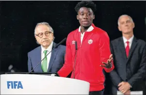  ?? AP PHOTO/ALEXANDER ZEMLIANICH­ENKO ?? Alphonso Davies of Canada speaks at the FIFA congress on the eve of the opener of the 2018 soccer World Cup in Moscow, Russia, Wednesday.