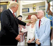  ?? AP Photo/Alex Brandon ?? President Donald Trump greets Velma Stratton and USS Arizona survivor Donald Stratton during a meeting with survivors of the attack on the USS Arizona at Pearl Harbor in the Oval Office of the White House on Friday in Washington.