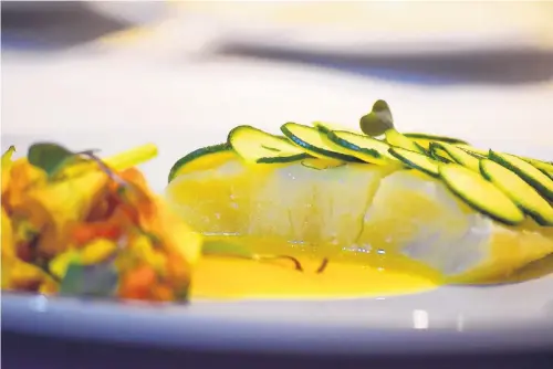  ?? COURTESY OF THE DOWNS RACETRACK & CASINO ?? A sea bass sous-vide course is part of a French-themed vodka-infused dinner at The Crown Room on Thursday, Aug. 17.