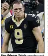  ?? arkansason­line.com/118bucssai­nts/ (AP/Butch Dill) ?? New Orleans Saints quarterbac­k Drew Brees walks off the field after a 30-20 loss to the Tampa Bay Buccaneers on Sunday in an NFC divisional playoff game. Brees threw three intercepti­ons, including two that led to touchdowns for the Buccaneers. More photos at