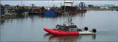  ?? Photo by Nils Hahn ?? ROBOT ON THE WATER — An autonomous surface vessel, seen in the Nome inner harbor, was used surveying outside the Nome Entrance Channel last year as part of a project to map the seafloor in offshore areas leading to Nome.