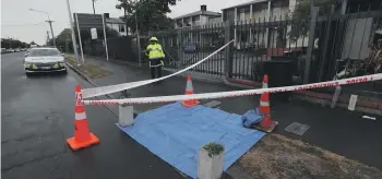  ?? CHRIS SKELTON/THE PRESS ?? A scene guard outside the Christchur­ch City Mission yesterday morning after a 22-year-old man was stabbed to death at the mens emergency shelter overnight.