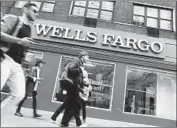  ?? Spencer Platt Getty Images ?? WELLS FARGO still faces a host of other lawsuits and inquiries from federal, state and local agencies.