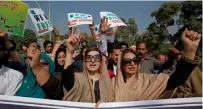  ??  ?? Mushaal Malik, wife of Kashmiri leader Yasin Malik and other women chant slogans at a rally in Islamabad to express solidarity with Kashmiris who died recently in Indian administer­ed Kashmir. — AP