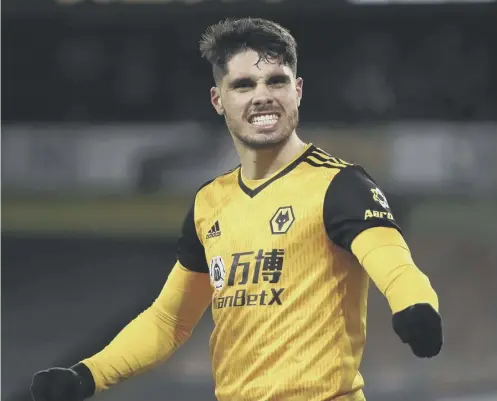  ??  ?? 0 Pedro Neto celebrates after his goal in the fifth minute of stoppage time clinched victory for Wolves at Molineux last night