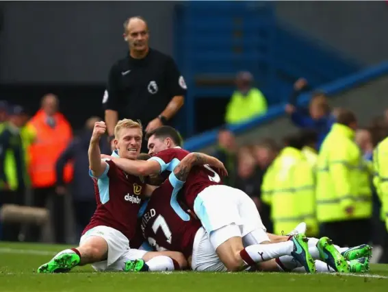  ??  ?? Burnley players celebrate after Scott Arfield's winner against Everton (Getty)