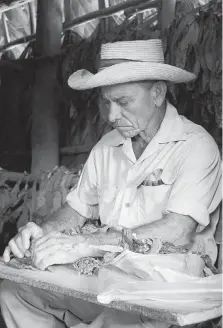  ?? DAVID SOVKA ?? Old-school cigar rolling by a pro. Strict quality control ensures that cigars are well made and properly rolled with no flaws.