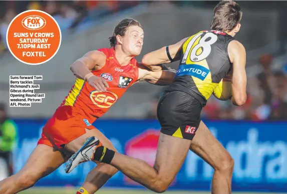  ?? ?? Suns forward Tom Berry tackles Richmond’s Josh Gibcus during Opening Round last weekend. Picture: AFL Photos